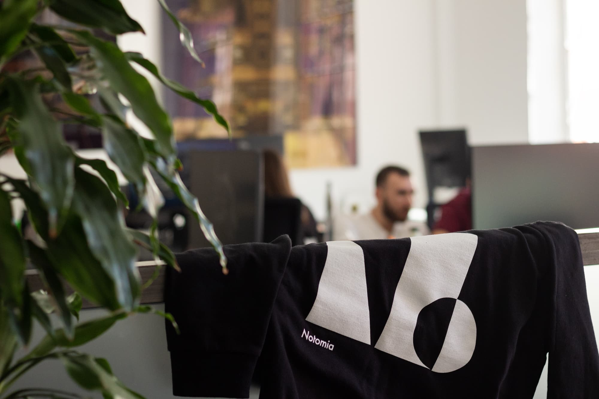 Notomia's office and branded sweater